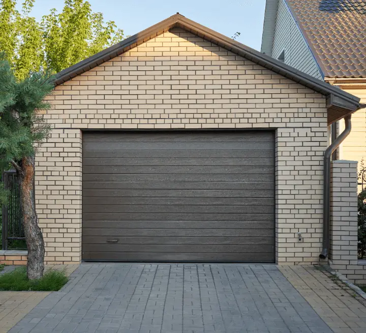 An image of a garage with a brown door